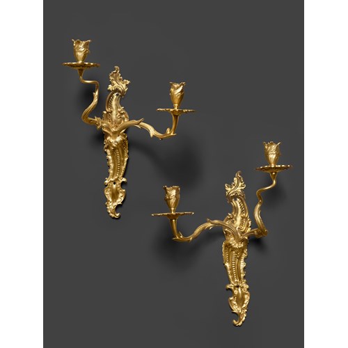 A paire of early Louis XV ormolu two-light wall-lights